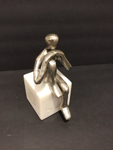 7" Silver Metal Person Sitting on Marble
