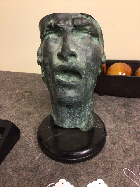 Metal Face Sculpture On Base