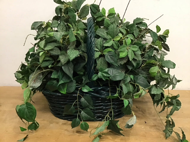 Mixed Foliage In Green Wicker Basket