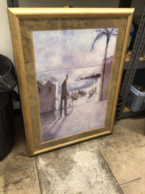 31 5/8" X 42 1/8" Gold Framed Man & Bicycle At The Beach Print