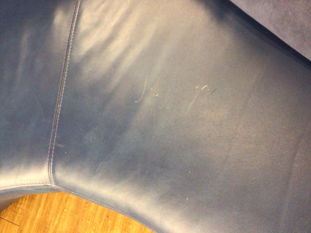AS-IS Blue Curved Sofa W/Two Pillows (Scratches In Leather)