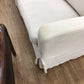 AS-IS RH Slip Cover Sofa (Light Stain On Arm)