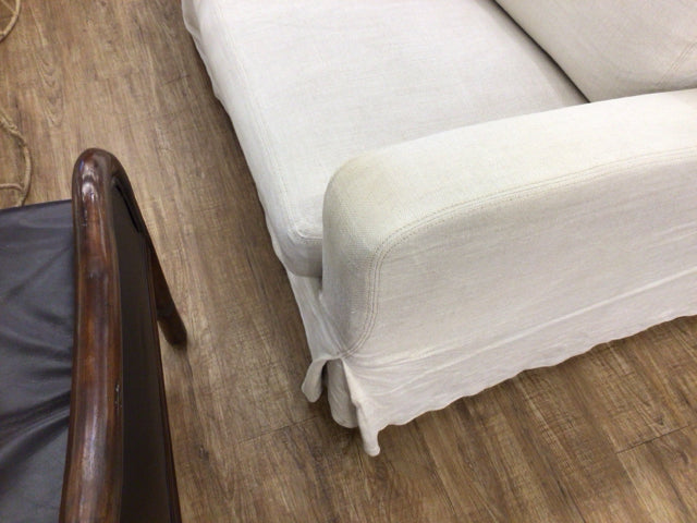 AS-IS RH Slip Cover Sofa (Light Stain On Arm)