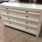 61" X 16 1/2" AS-IS HomeleganceGlass Top Zandra Eight Drawer Dresser