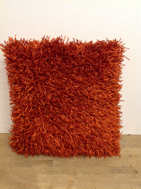 Orange shag feather pillow