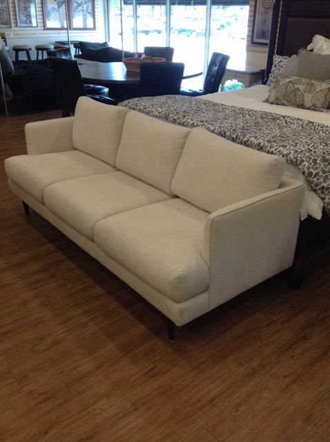 Tan Upholstered Sofa w/Wood Feet