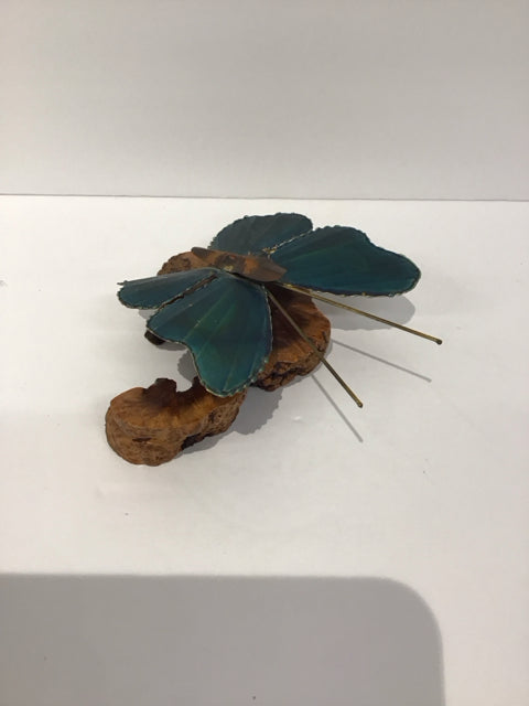 Blue Metal Butterfly Perched on Wood