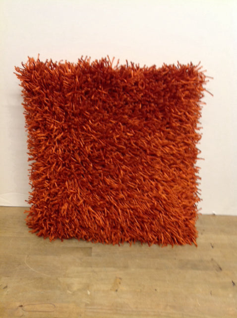 Orange shag feather pillow