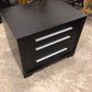 AS-IS Black Three Drawer Glass Top Nightstand(Damage In Bottom Drawer)