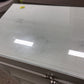 61" X 16 1/2" AS-IS HomeleganceGlass Top Zandra Eight Drawer Dresser