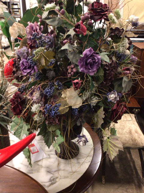 Purple Floral Arrangement In Footed Vase